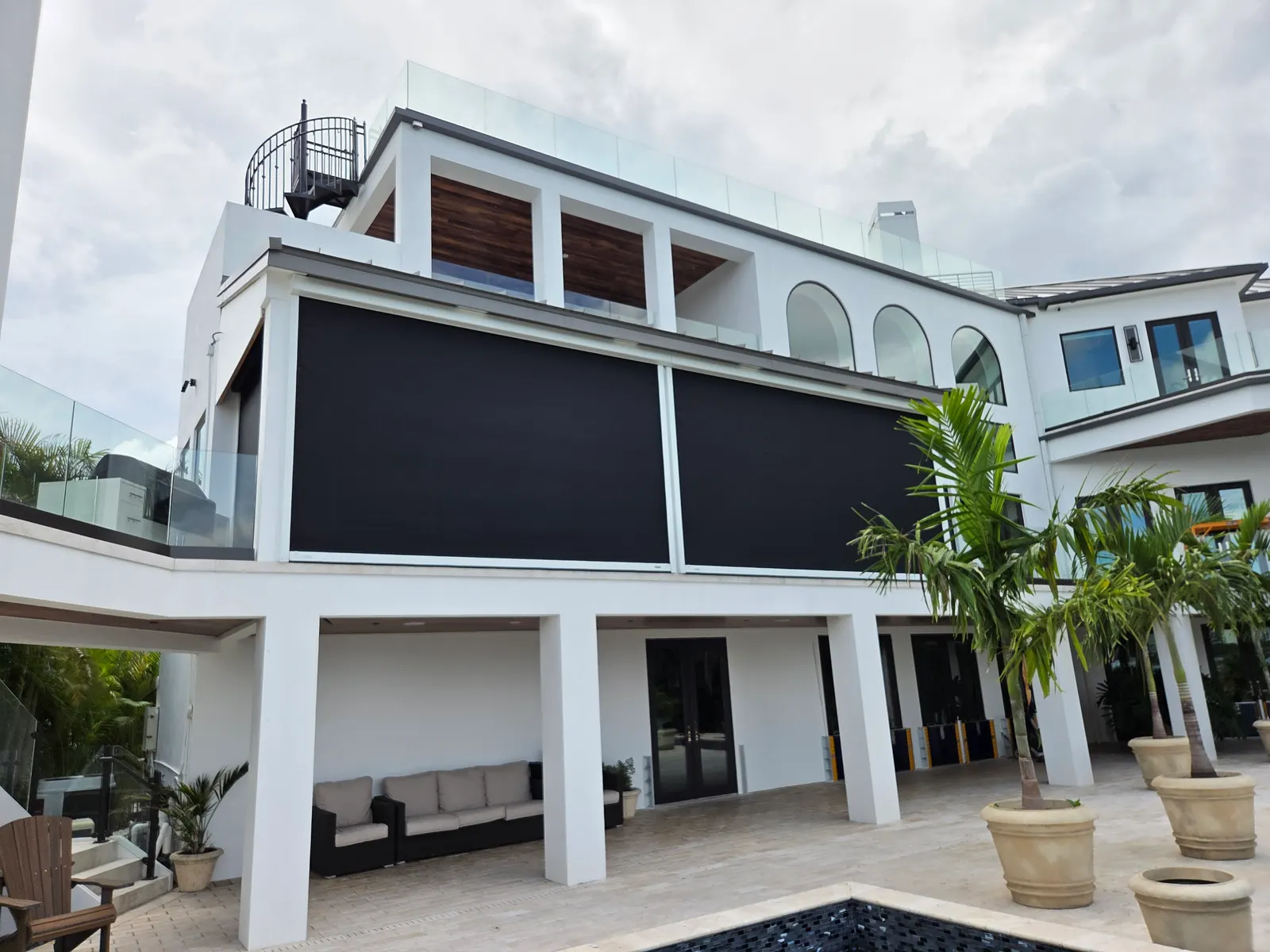 Motorized retractable screens on a luxury Sarasota estate balcony